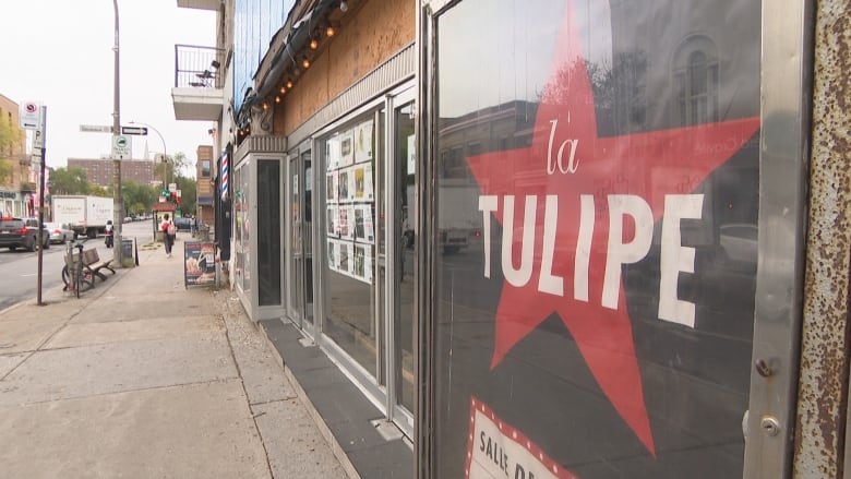 A closeup of an exterior sign for the music venue La Tulipe