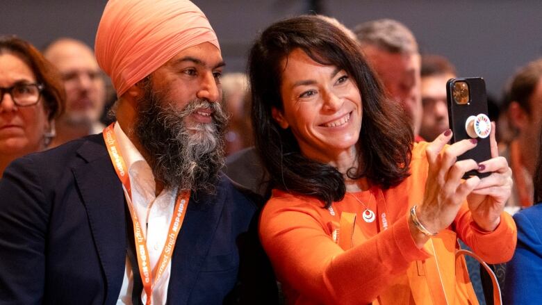 NDP MP Heather McPherson takes a selfie with NDP Leader Jagmeet Singh during the opening of the NDP Convention in Hamilton, Ont. on Friday, October 13, 2023.