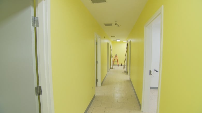 A hallway with yellow walls 