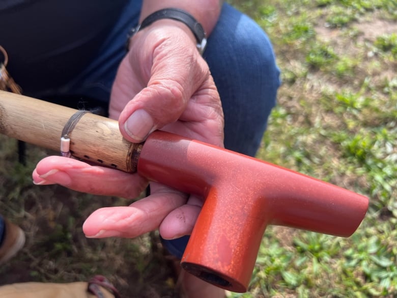 One of more than 30 pipes Mike Hopkins uses for traditional pipe ceremonies. He cut, bored and polished the stone end that holds the tobacco and also shaped the sumac wood which forms the handle.