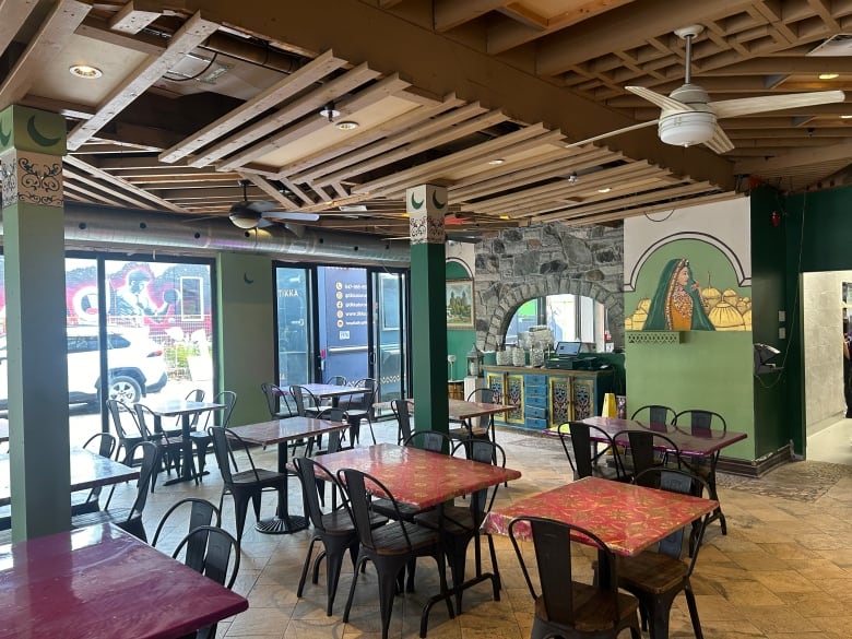 An empty restaurant is visible inside with fresh paint and new furniture