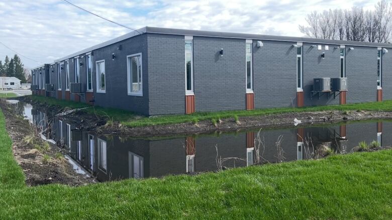 A building surrounded by water.