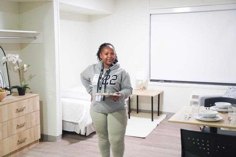 Hellen Kusasira, a housing worker with Fred Victor, is photographed in one of the units at the site of a new Social Medicine Housing Initiative in Toronto, on Oct. 2, 2024.