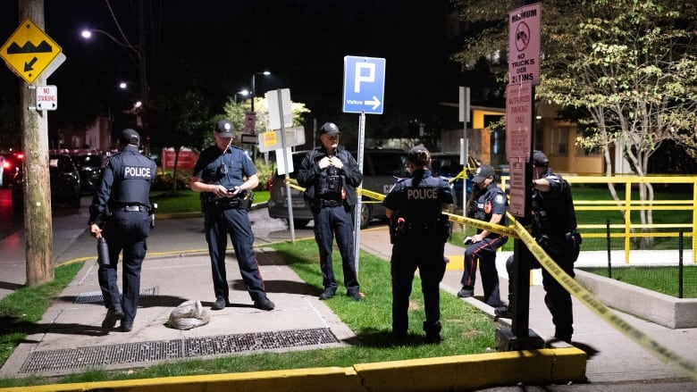 Toronto police work the scene where an officer was shot on Oct. 2, 2024.