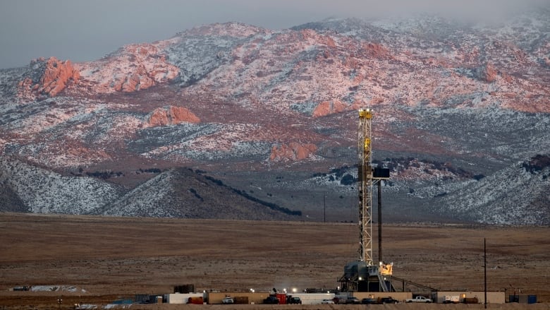 A drill rig stands at a geothermal site under construction in Utah.