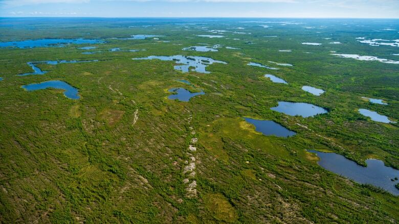 Lakes and a landscape can be seen as well as pegmatite rocks.