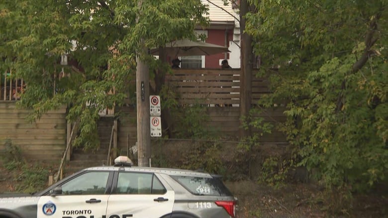 Toronto police were seen at this address, an apartment in a home in the area of Keele Street and Dundas Street West, on Friday after they reported that a woman believed to be in her 60s was found dead in a home on Oct. 1. The woman is allegedly the first victim of a woman charged with three murders.