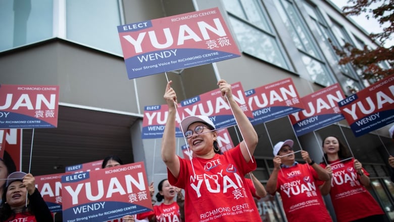 Independent candidate Wendy Yuan rallies with volunteers outside her campaign headquarters for the riding of Richmond Centre in Richmond, British Columbia on Friday, September 27, 2024. 