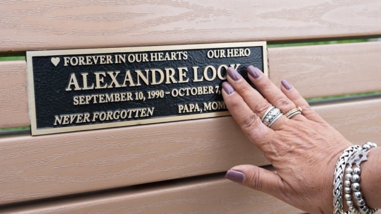 hand touching plaque. 