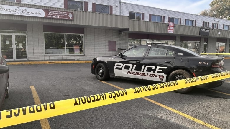 Police car in front of a building. 