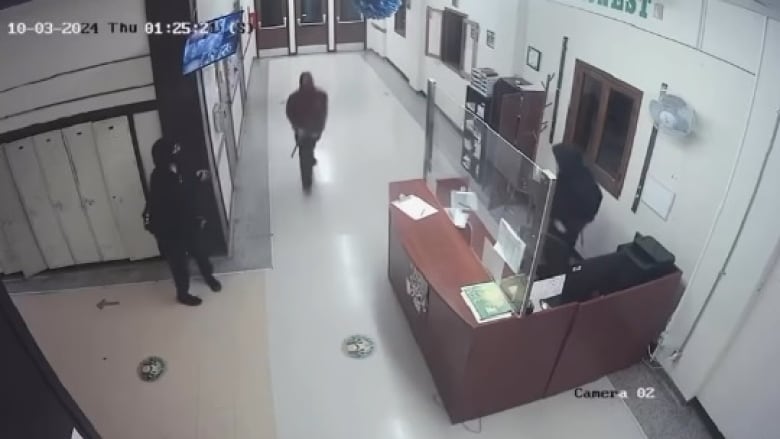 Security footage from a recent Windsor Islamic High School break-in. Three masked people wearing black can be seen in this screenshot. 