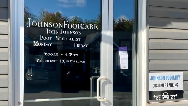 A sign on a door reads Johnson Footcare, John Johnson, Foot Specialist, Monday - Friday, 9:00 AM - 4:30 PM. 