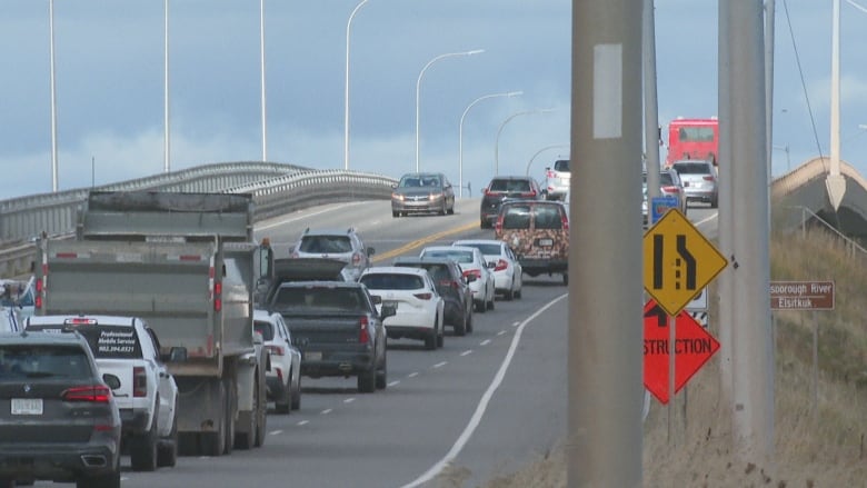 Heavy traffic crosses a bridge.