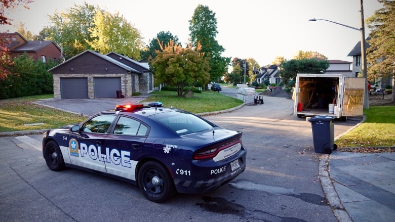 Police perimeter near homes.