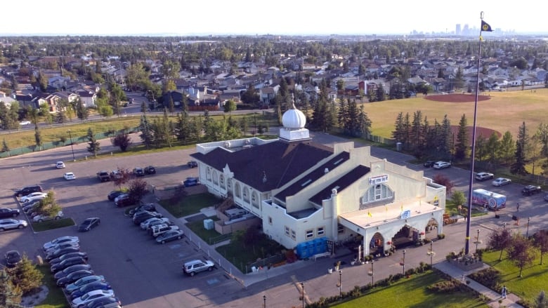 An ariel view of a large white building.