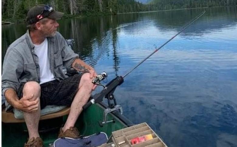 A man fishing on a dock.