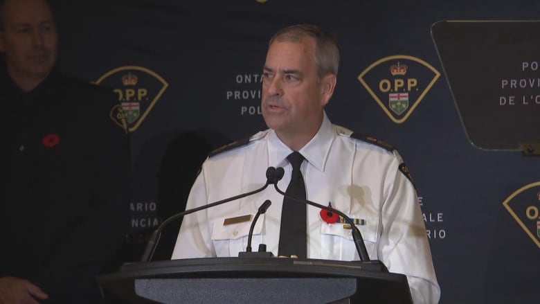 Photo of a police commisioner speaking during a news conference