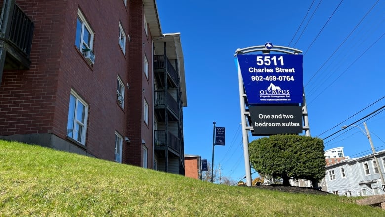 A sign at a property is shown, saying one and two-bedroom suites. 