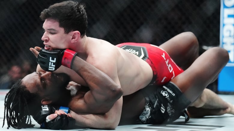 Mike Malott, top, fights Neil Magny during a welterweight bout at UFC 297 in Toronto on Saturday, January 20, 2024. 