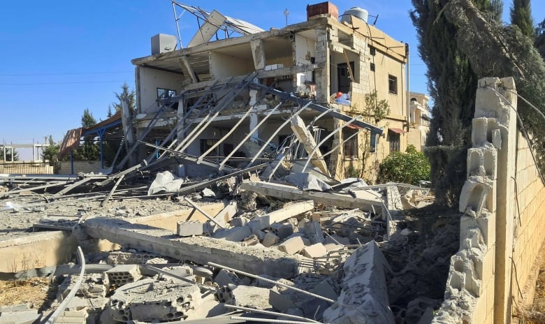 A view shows a site damaged in the aftermath of Israeli strike in the town of al-Alaq west of Baalbek, in Lebanon's Bekaa Valley.