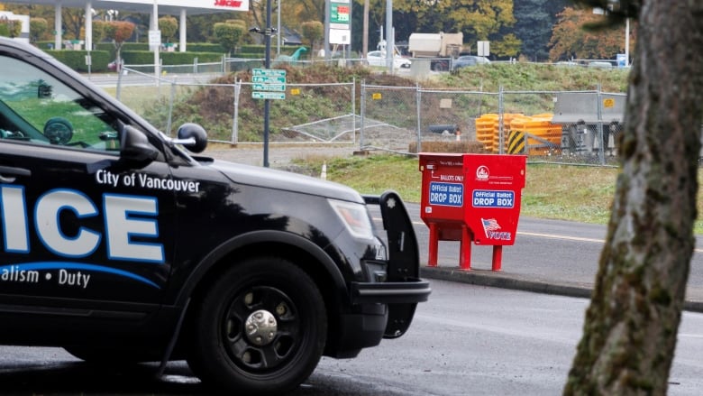 A vehicle is seen  in Vancouver, Wash., at the site where a new ballot box has been placed at the Fisher's Landing Transit Center.