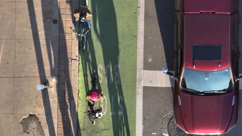 Aerial (drone) images of evening commute along Bloor St. W in the Junction neighbourhood and bike lanes