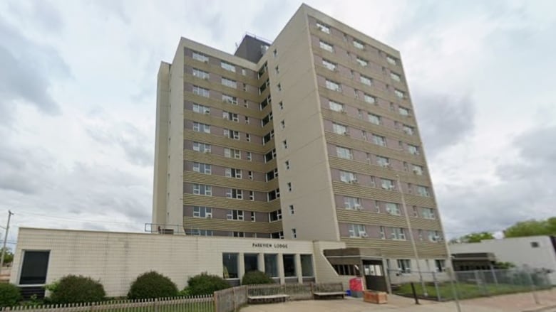 A highrise building says Parkview Lodge over its front entrance.