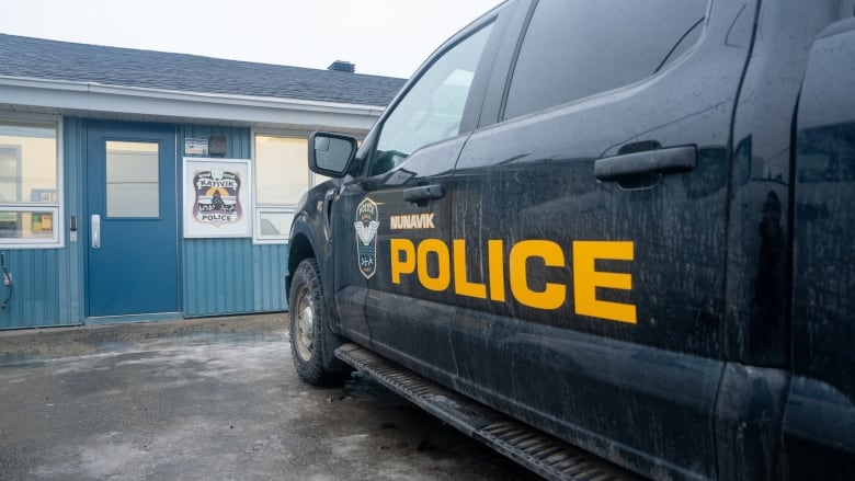 police car in front of police station