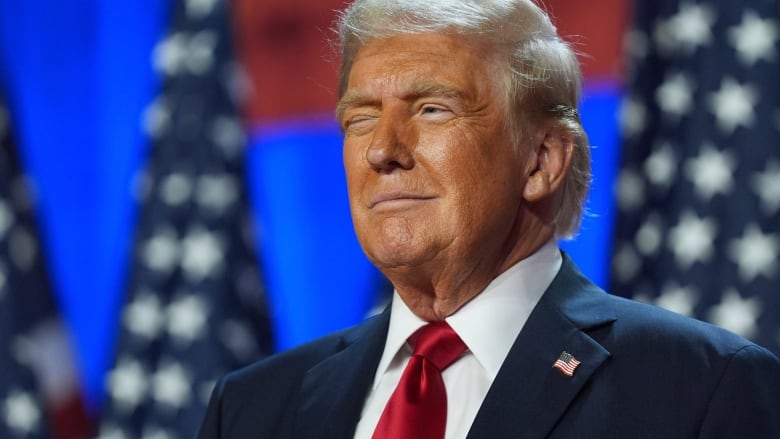 Republican presidential nominee Donald Trump listens at an election night watch party at the Palm Beach Convention Center on Wednesday, Nov. 6, 2024, in West Palm Beach, Fla.