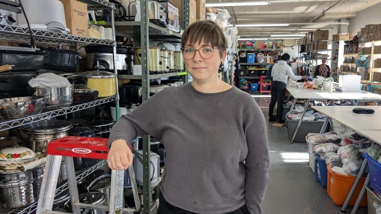 woman in warehouse with house supplies