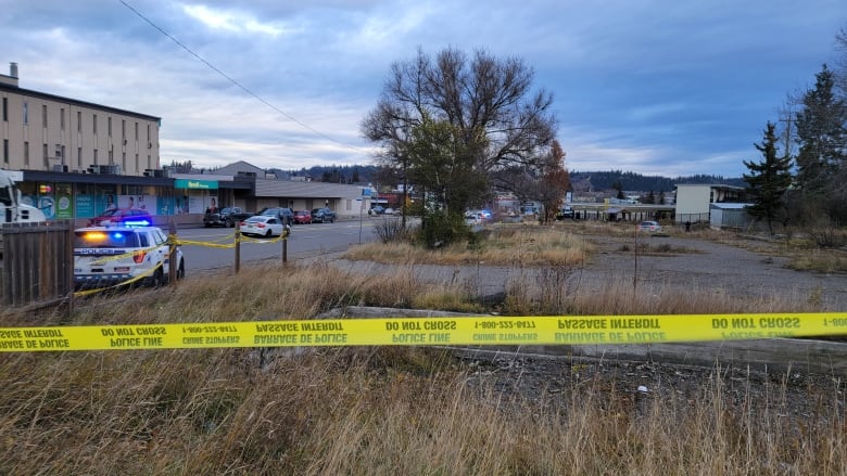 Police tape and a field.