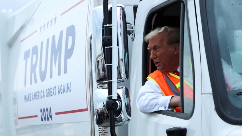 Trump seen in passenger seat of garbage truck