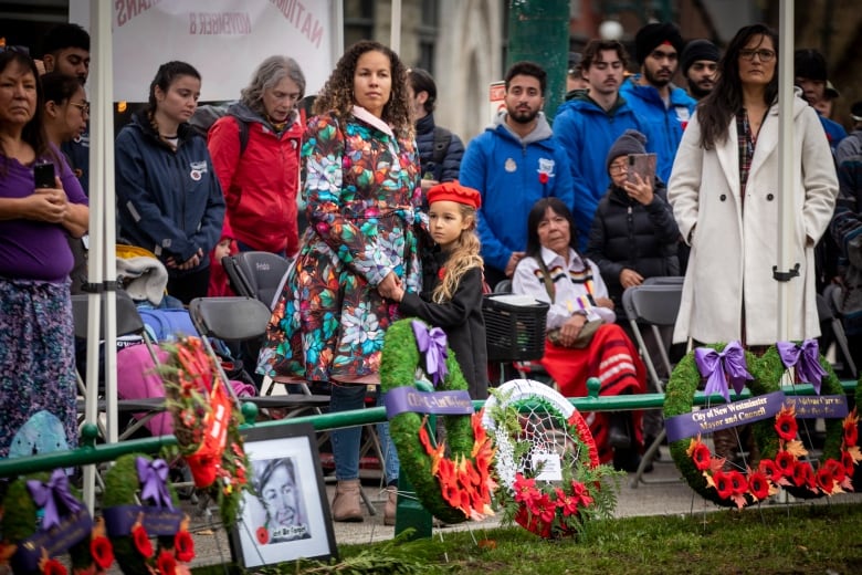 Spectators watch as the Last Post is played at Victory Square Cenotaph in honour of National Indigenous Veterans Day in Vancouver, B.C, on Friday, Nov, 8, 2024