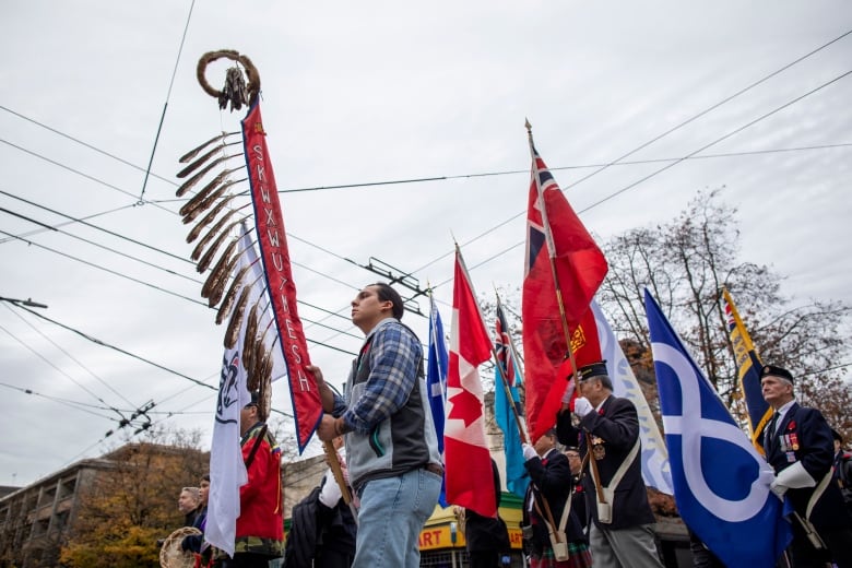 Veterans and spectators march National Indigenous Veterans Day.