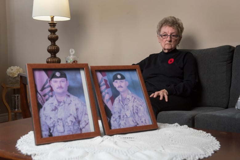 National Silver Cross Mother Maureen Anderson is shown with photos of her sons Sgt. Ron Anderson, left, and Sgt. Ryan Anderson, in her home in Oromocto, N.B. on Thursday, October 31, 2024.