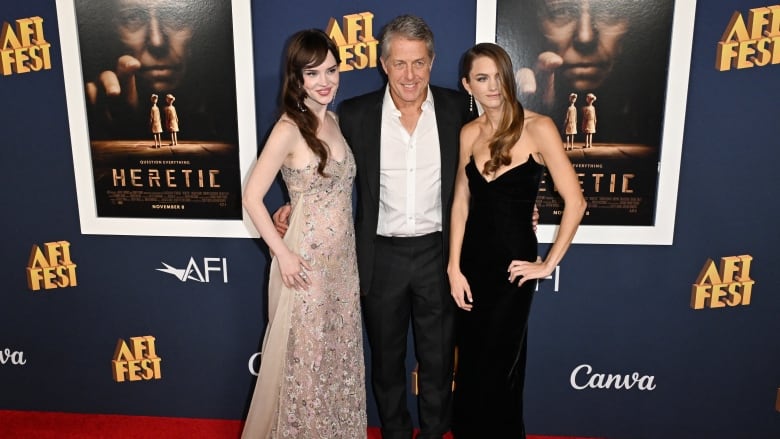 (From L) US actress Sophie Thatcher, British actor Hugh Grant and US actress Chloe East attend the US premiere of 