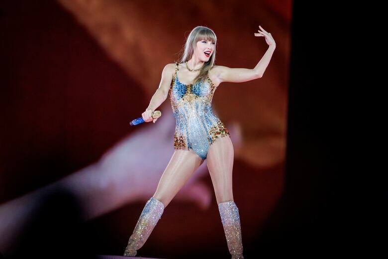 Taylor Swift on stage, performing first two songs of The Eras Tour at Rogers Centre.