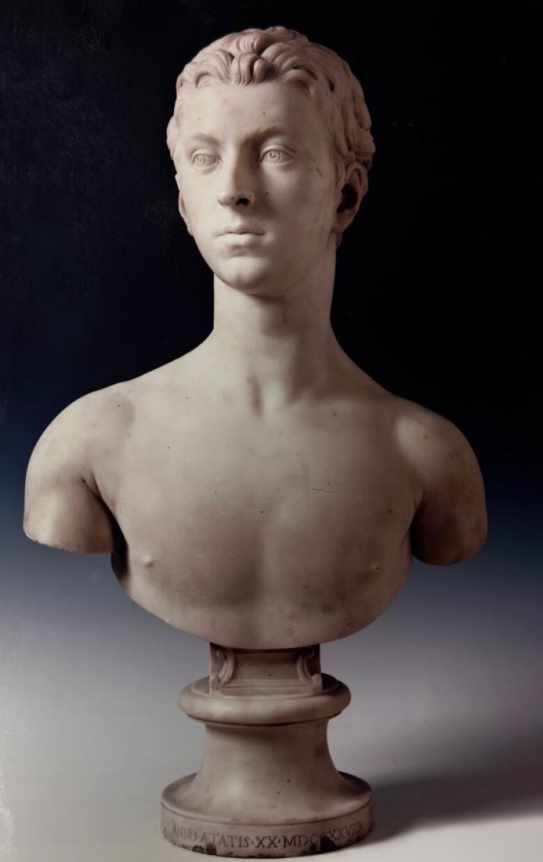 White marble bust of a young man 