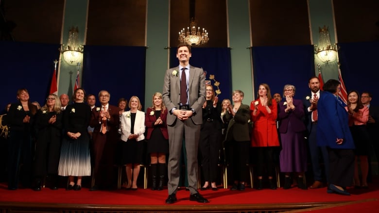 people stand on a stage