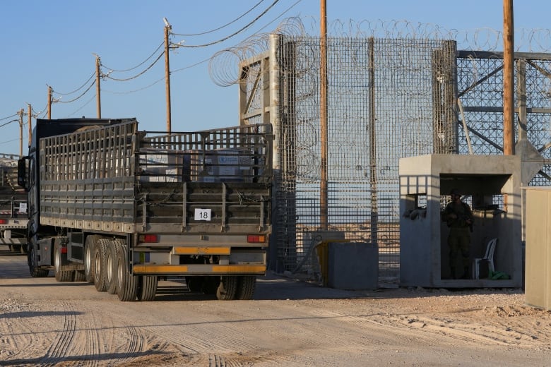 A truck enters a crossing.