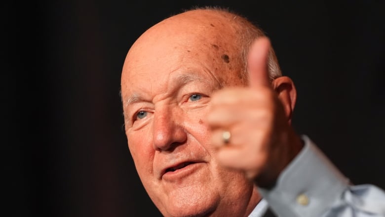 Pete Hoekstra gives a thumbs-up gesture during an election night watch part in Novi, Mich.