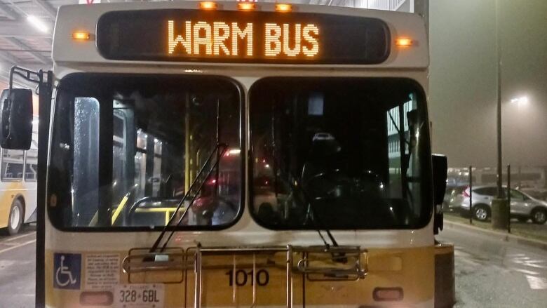 A bus with the words Warm Bus on the front. 